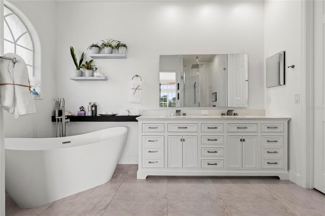 bathroom featuring a wealth of natural light, shower with separate bathtub, vanity, and tile patterned flooring