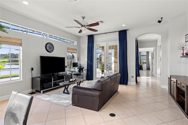 living room featuring french doors, ceiling fan, and light tile patterned floors