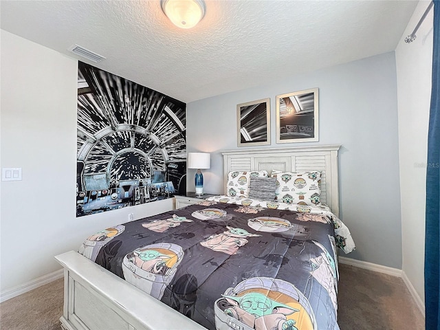 carpeted bedroom with a textured ceiling