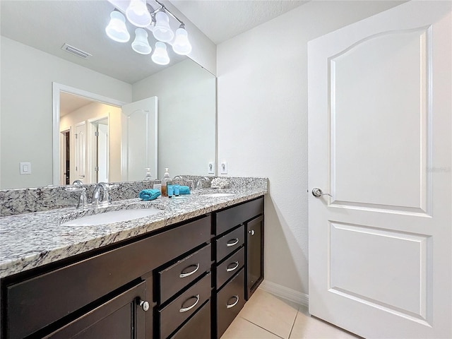 bathroom with vanity and tile patterned floors