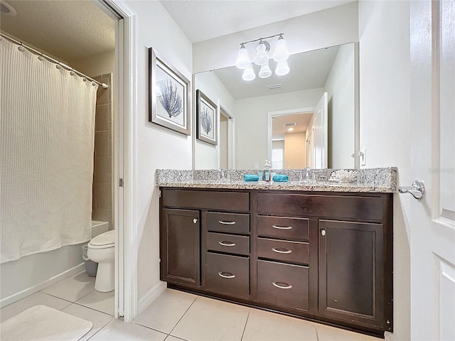 full bathroom featuring vanity, toilet, shower / bath combo with shower curtain, and tile patterned flooring