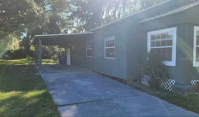 view of home's exterior featuring a carport