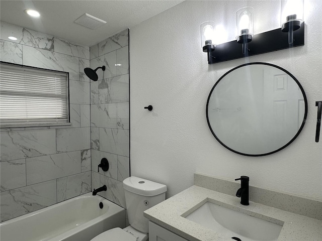 bathroom with visible vents, vanity, washtub / shower combination, and toilet