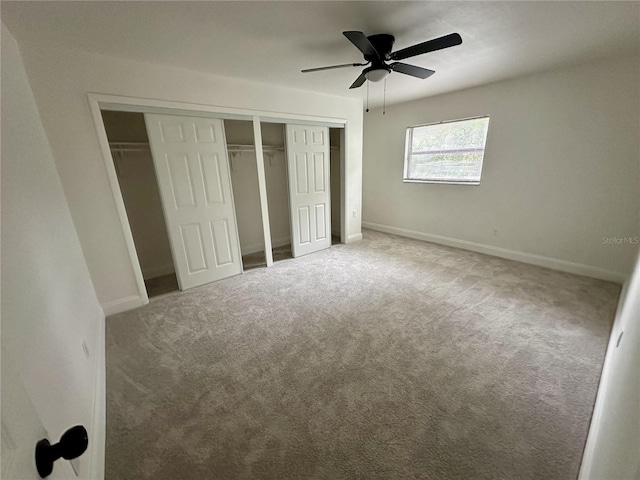 unfurnished bedroom featuring carpet and ceiling fan