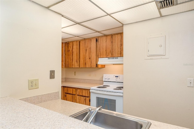 kitchen featuring electric stove, electric panel, and sink