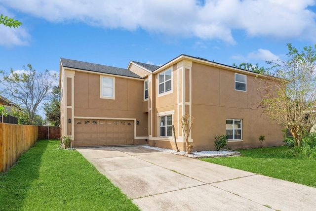 view of front of property featuring a front yard and a garage