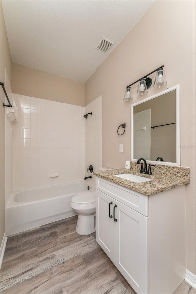 1344 Holly Glen Run, Apopka, FL 32703 - full bathroom featuring shower / bath combination, toilet, vanity, and wood finished floors