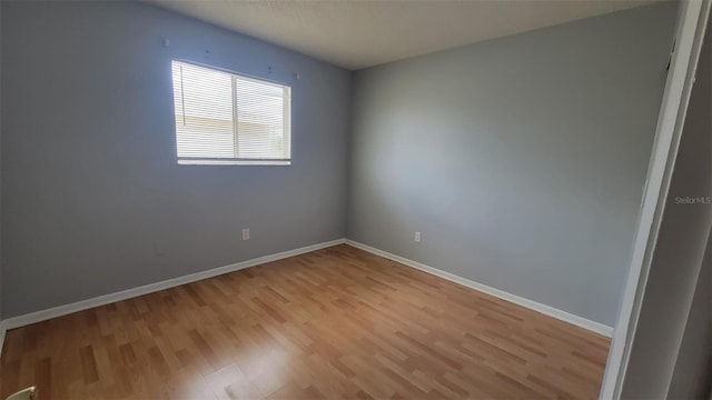 spare room featuring light hardwood / wood-style floors