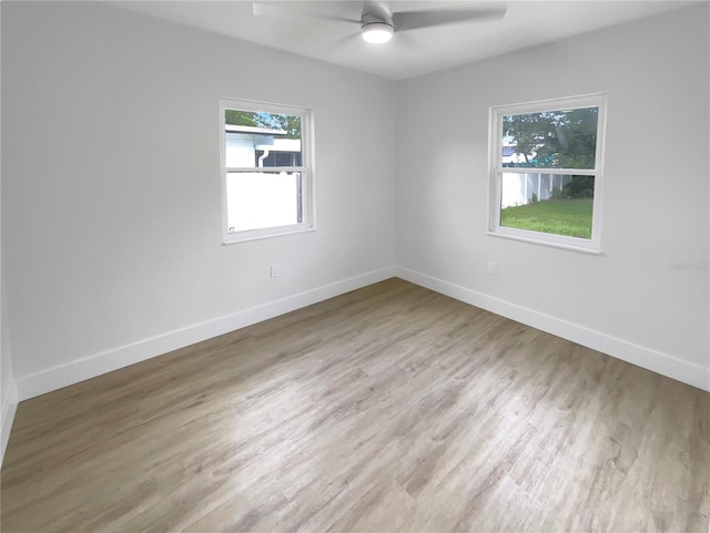 unfurnished room featuring ceiling fan and light wood-type flooring