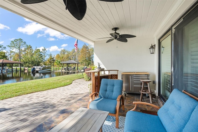 view of patio with a water view