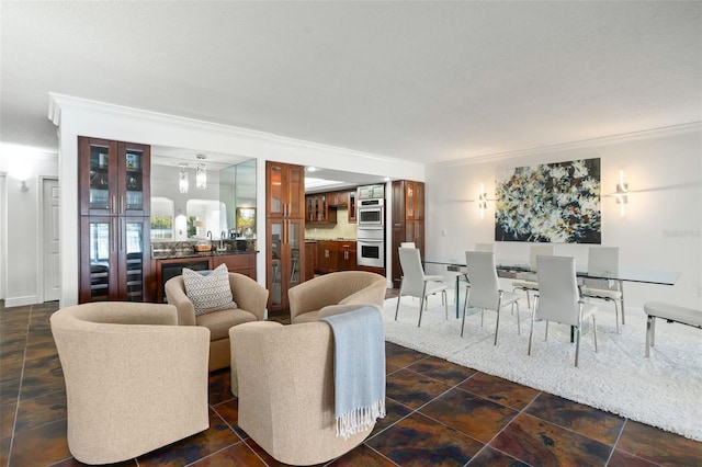 8984 Houston Pl Unit 103, Orlando, FL 32819 - living room featuring crown molding and bar area