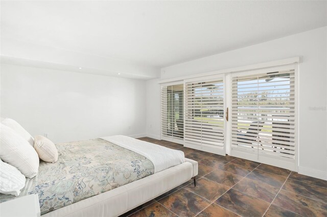 8984 Houston Pl Unit 103, Orlando, FL 32819 - bedroom with access to outside and baseboards