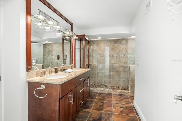 8984 Houston Pl Unit 103, Orlando, FL 32819 - bathroom featuring double vanity and a stall shower