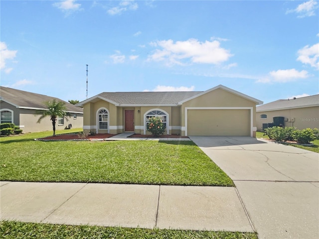 single story home with a front yard and a garage