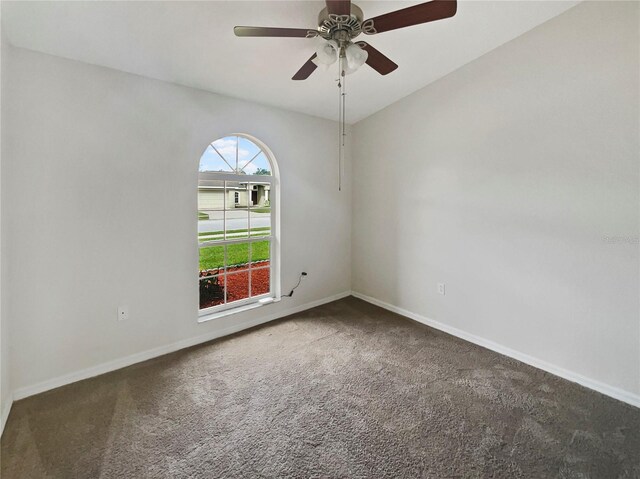 unfurnished room featuring carpet flooring and ceiling fan