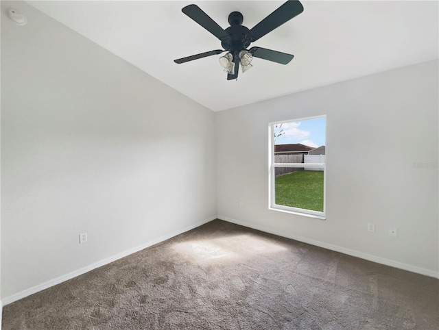 unfurnished room featuring ceiling fan, vaulted ceiling, and carpet floors