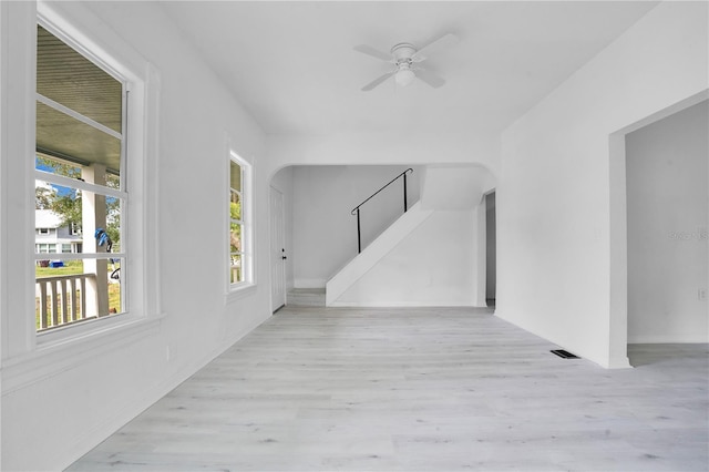 hallway with light hardwood / wood-style floors