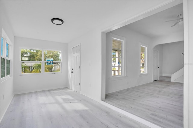 interior space with a healthy amount of sunlight and ceiling fan