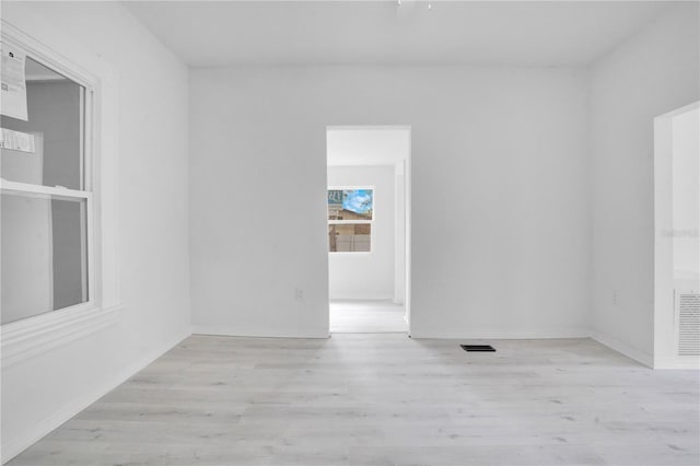 spare room with light wood-type flooring