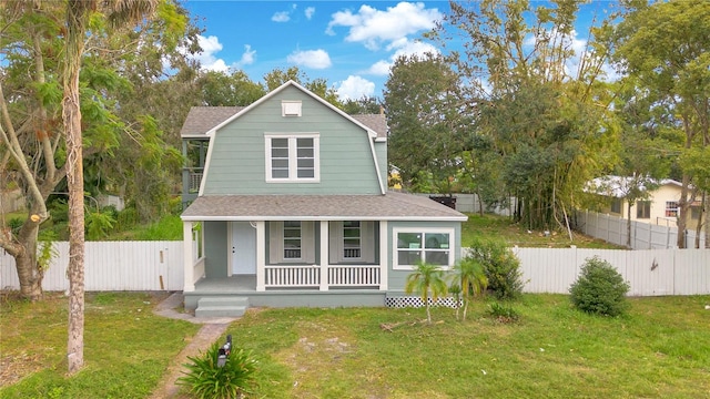 view of front of home with a porch and a front yard