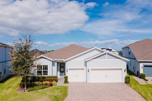 single story home with a front yard and a garage