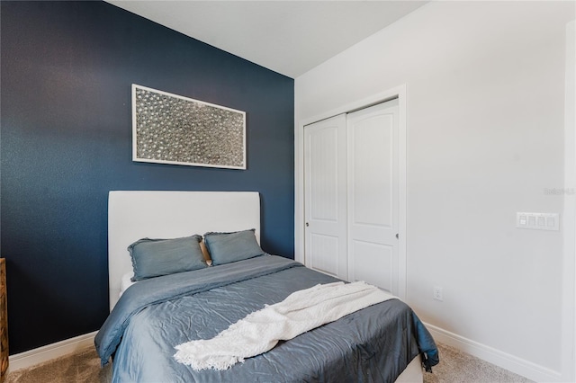 carpeted bedroom with a closet