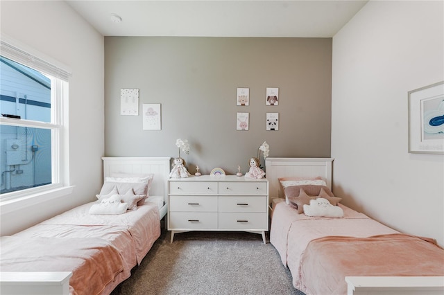 bedroom with dark colored carpet