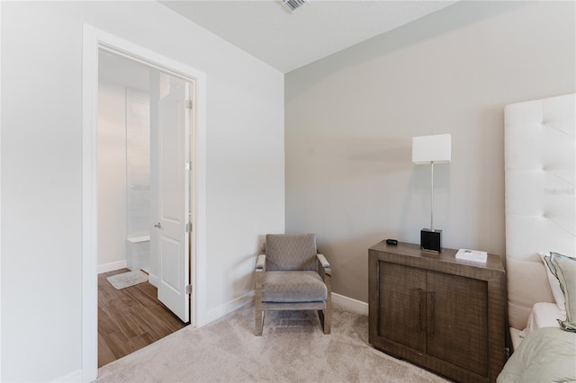 sitting room featuring hardwood / wood-style floors