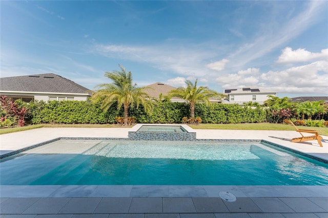 view of swimming pool featuring an in ground hot tub and a patio area