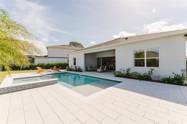 view of pool featuring an in ground hot tub and a patio area