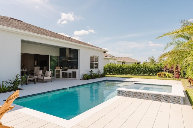 view of swimming pool with an in ground hot tub and a patio area