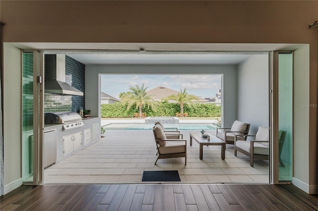 view of patio / terrace featuring area for grilling and a grill