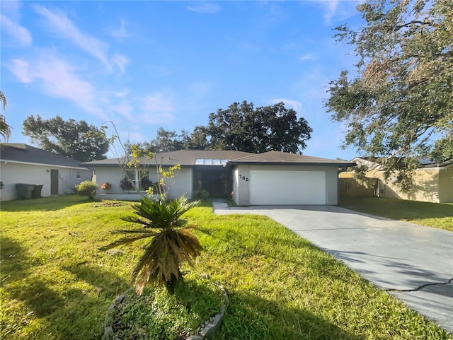 single story home with a front yard and a garage