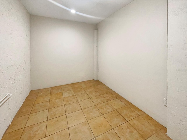 spare room featuring light tile patterned floors