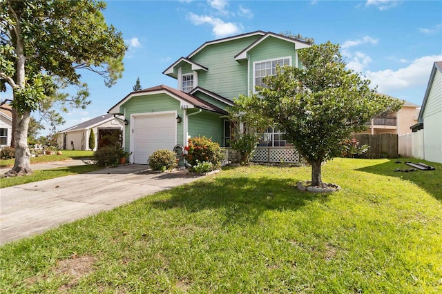 view of front facade with a front yard and a garage