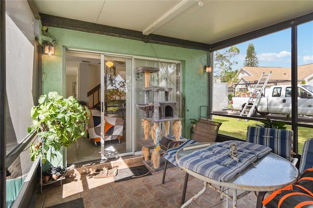 sunroom with beam ceiling