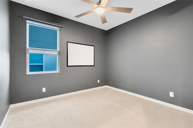 carpeted empty room featuring ceiling fan