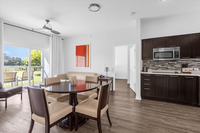 dining room featuring hardwood / wood-style floors, a textured ceiling, and ceiling fan