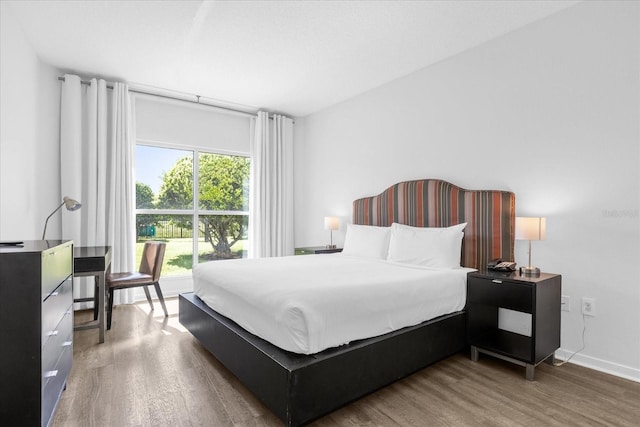 bedroom featuring dark wood-type flooring