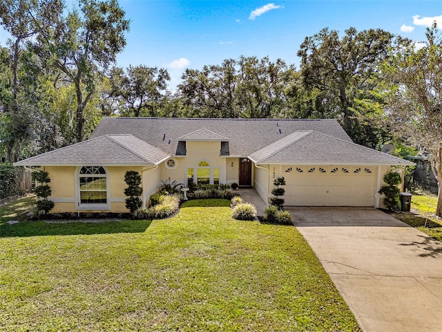 single story home with a garage and a front lawn