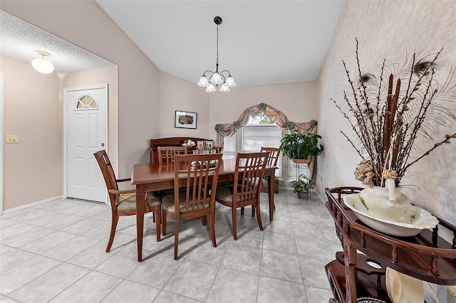 dining space with a notable chandelier, a textured ceiling, vaulted ceiling, and light tile patterned floors