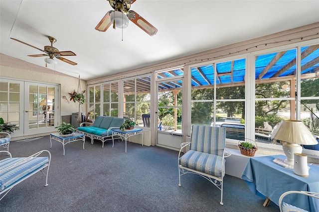 sunroom / solarium featuring lofted ceiling, french doors, and ceiling fan