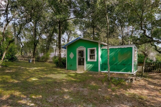 view of outbuilding with a yard