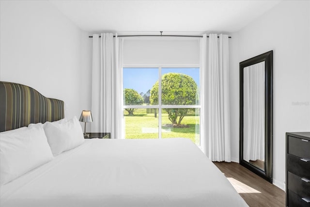 bedroom featuring dark hardwood / wood-style floors