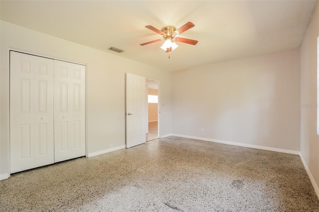 unfurnished bedroom with a closet and ceiling fan