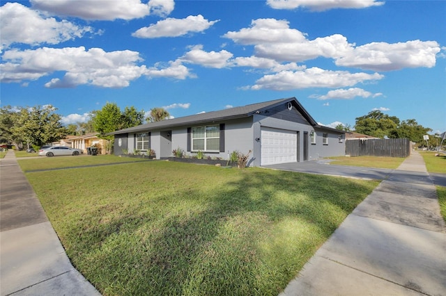 single story home with a garage and a front lawn