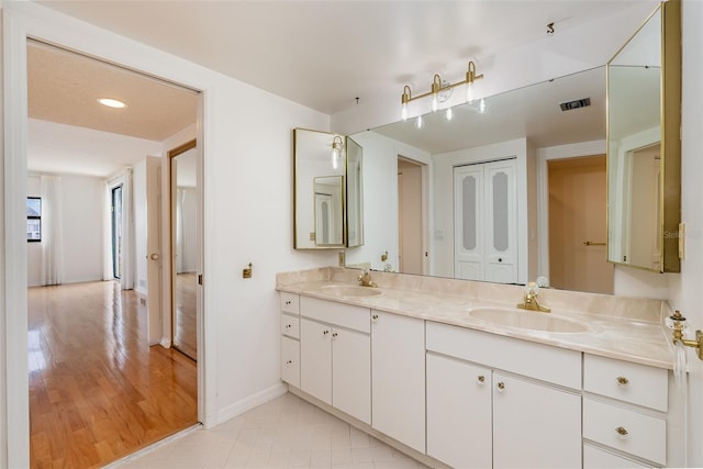 bathroom featuring vanity and wood-type flooring