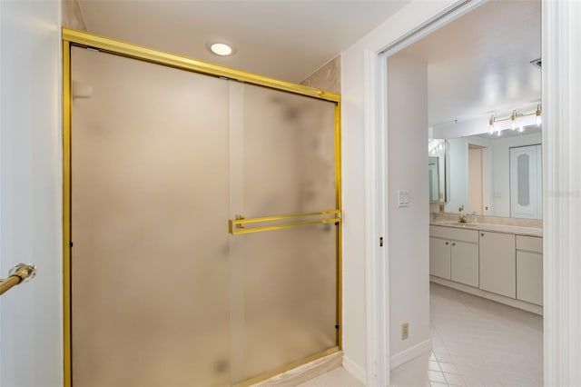 bathroom featuring vanity, tile patterned floors, and an enclosed shower