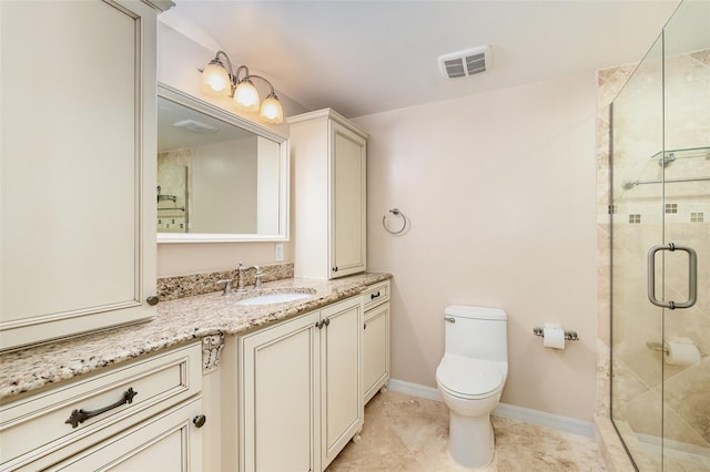 bathroom with vanity, tile patterned floors, toilet, and walk in shower