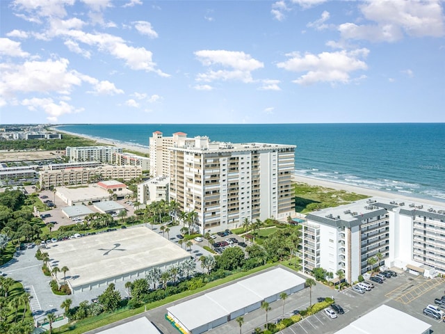 birds eye view of property featuring a view of the beach and a water view